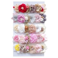 Obraz na płótnie Canvas Handmade flower headband hair accessory made out of fabric flowers in beautiful pastel colors
