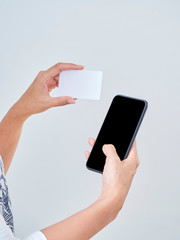Obraz na płótnie Canvas Woman with smartphone and credit card