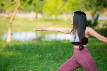 Naklejka na ściany i meble Beautiful asian fat woman play yoga at the park,Need to slim fit body