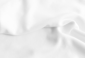 White abstract wavy clothes background. fabric texture