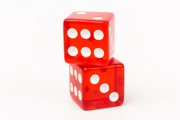 Transparent and red glass dices isolated on white background.