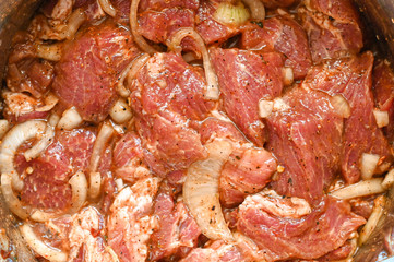 background of marinated meat with onions