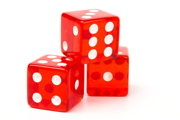 Transparent and red glass dices isolated on white background.