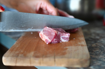 slicing fresh meat on a board