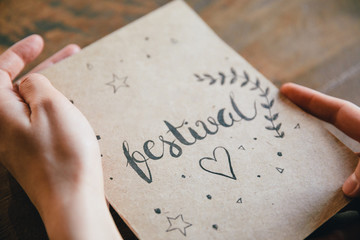 Hands holding a notebook