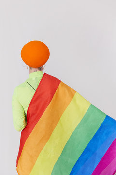 A woman wearing a rainbow top to celebrate equality.