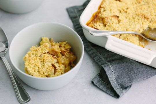 Horizontal shot of plain Apple Crumble in bowl