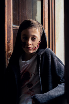 Portrait of a boy wearing a scary halloween make-up
