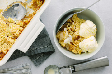 Bramley Apple Crumble with ice cream in bowl