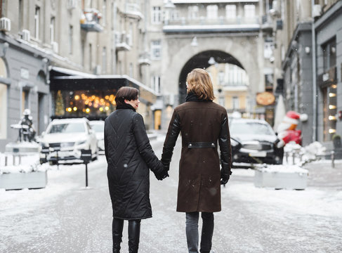 Winter love story, a beautiful stylish young couple.