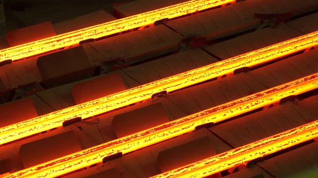 Red hot steel metal billets after molten steel casting. Continuous casting machine. Hot billet (bloom) continuous casting, also called strand casting
