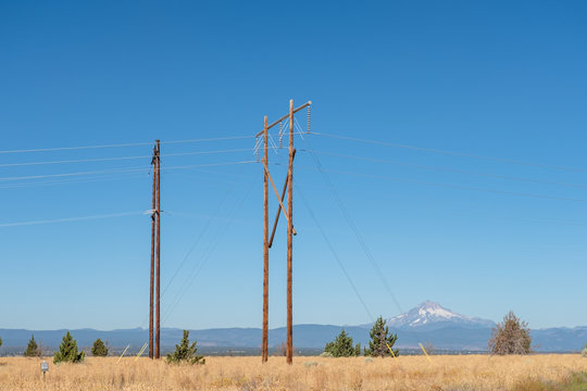 Power lines in the high desert against a blue sky