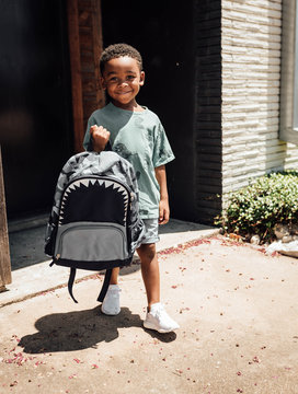 Boy walking backpack