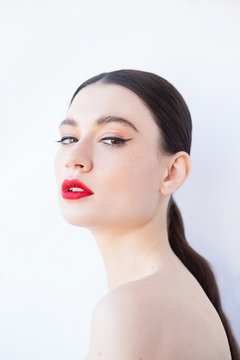 Glamour portrait of beautiful woman with red lips.