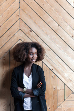 Corporate business style of young beautiful black african american woman posing in office