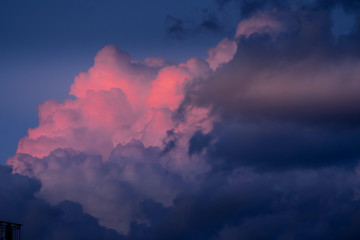 Sky with rose and dark clouds.Heavenly dreamy fluffy colorful fantasy clouds.