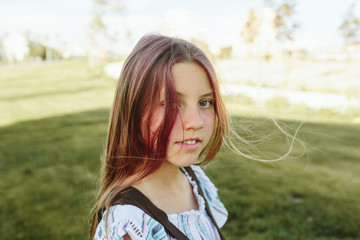 Teenage girl in sunlight with backpack
