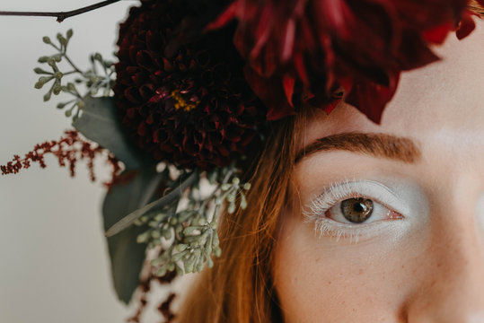 Bridal portraits of a beautiful red haired woman wearing a flower crown