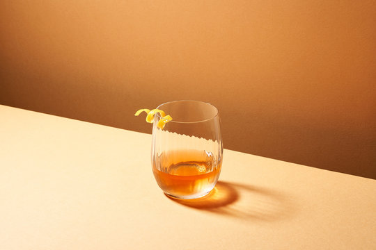 Alcoholic drink with lemon zest