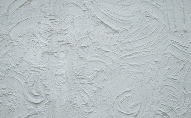 White plastered rough wall texture with large brush strokes