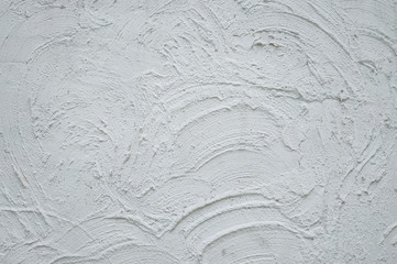 White plastered rough wall texture with large brush strokes