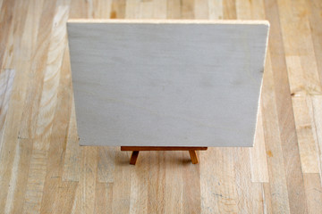 Wooden board on wooden floor. Free copy space for text
