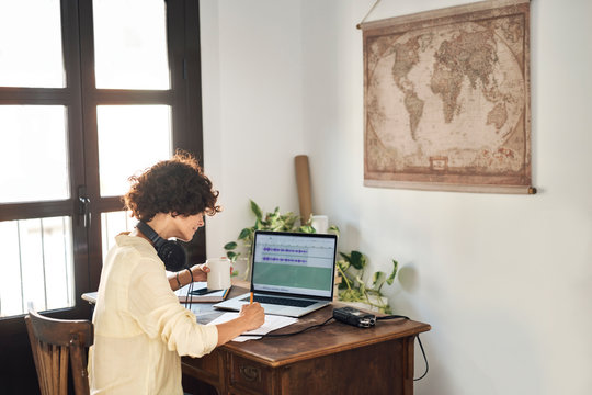 Woman preparing podcast in cozy room