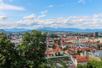 Fototapeta premium Landscape view over Ljubljana, with clouds and mountains in the background