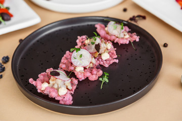 Smoked whitefish on tapioca chips, beige background