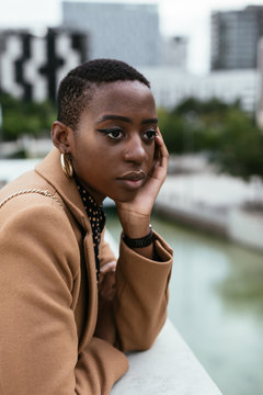 Dreamy African American woman looking away