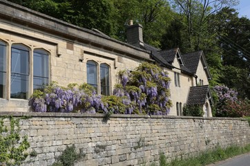  The Old School House and School on a main village road in Slad, Gloucestershire, England.