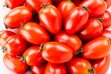 Close-up of fresh cherry tomatoes on a white dish