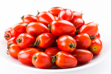 Close-up of fresh cherry tomatoes on a white dish