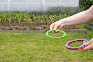 children's play ring toss on green grass