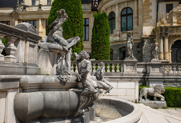 Fototapeta na wymiar Beautiful park with marble statues in Peles castle, Sinaia, Romania