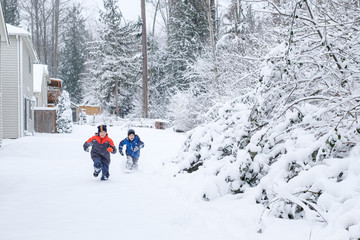 Asian Kids Running in the Snow