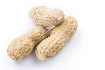 Close-up of delicious peanuts isolated on white background