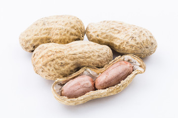 Close-up of delicious peanuts isolated on white background
