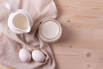 two white eggs and milk as calcium concept. minimalism style.
