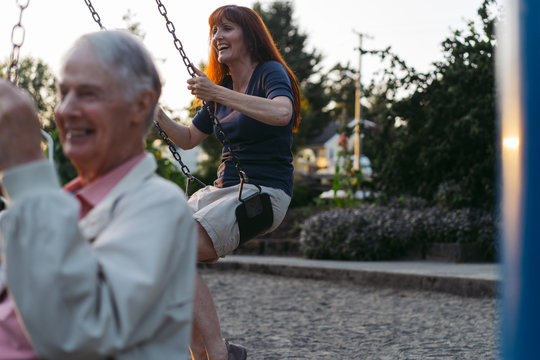 Senior man and middle age woman enjoying spending time together