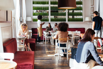 Waitress taking orders from clients