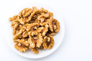 Close-up of delicious walnuts on a white dish