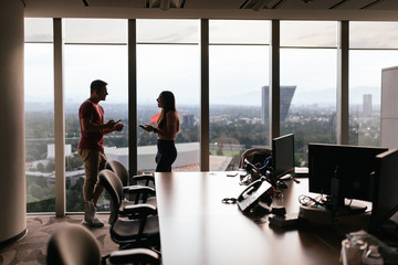 Caucasian man and hispanic woman in a meeting