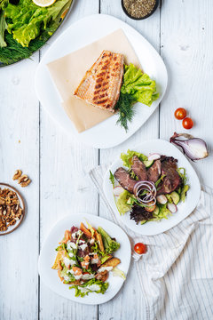 Plates with tasty fresh dishes