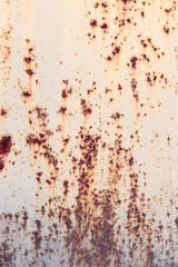 Creative bright metallic background. Flat background texture of dirty rusty metal. Bright rusty spots as the main background for a vintage scratched design