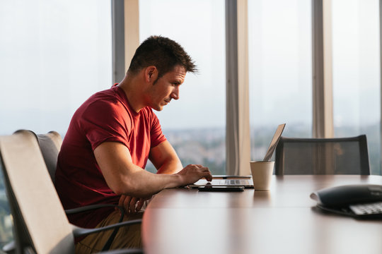 caucasian man in an indoor office with view