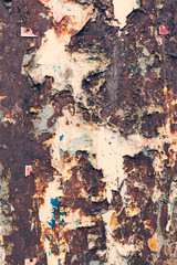 Creative metal background. Old metal background with scraps of paper ads. Flat background texture of dirty metal. As the main background for vintage design