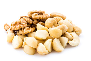Some cashews, macadamias, and walnuts on a white background.