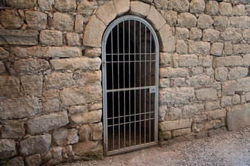Fototapeta na wymiar iron door in a stone wall