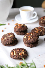 Vegan Almond oatmeal chocolate cookies set in cafe table.